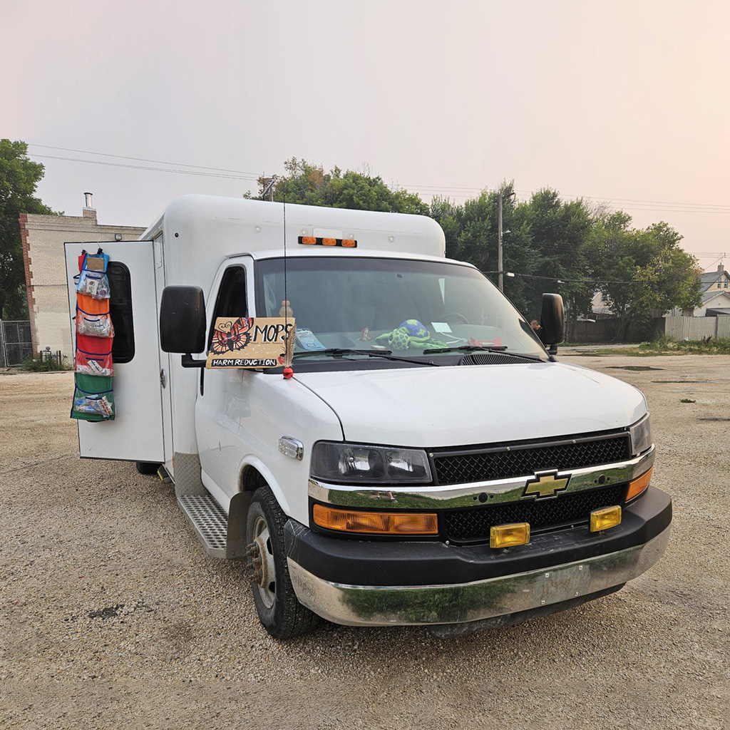 A photo of the Mobile Overdose Prevention Site (MOPS) vehicle -- a white converted ambulance.